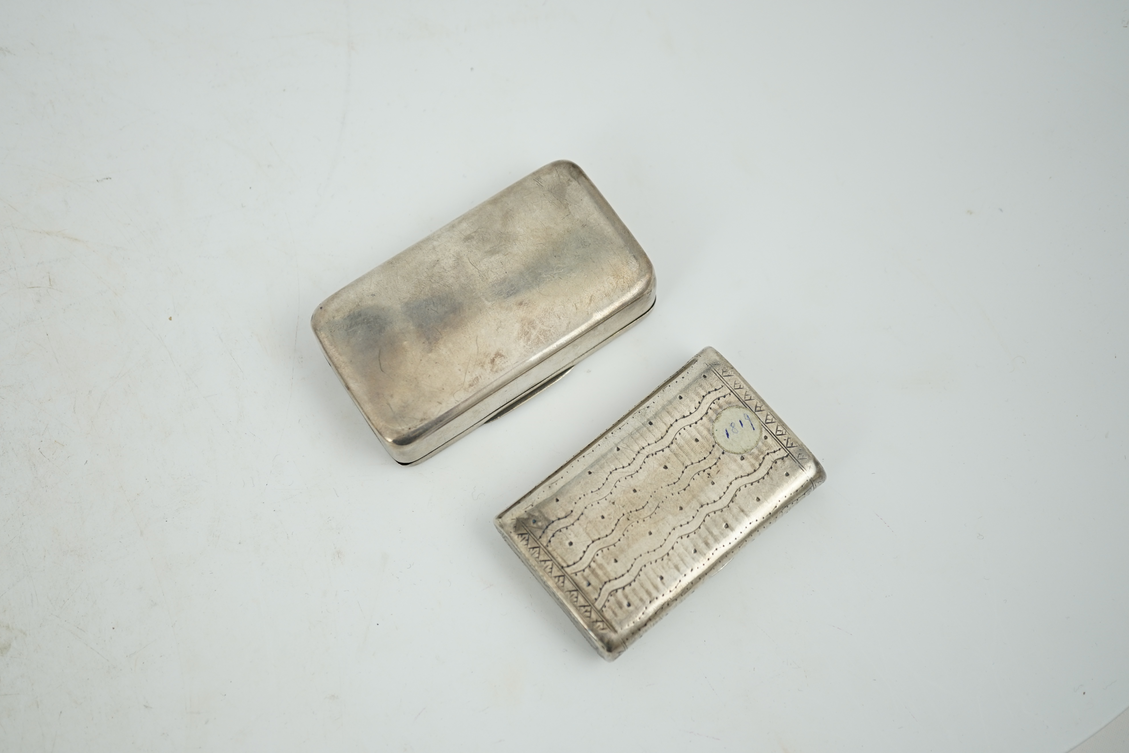 A George III silver snuff box, maker's mark rubbed, London, 1807, 74mm, together with an early 19th century Russian 84 zolotnik snuff box, dated 1819, 64mm.